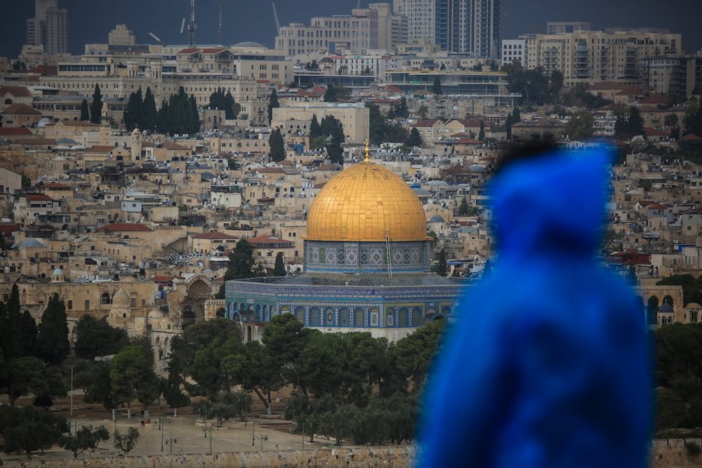 Palestinians behold the beauty of Al-Aqsa Mosque and its surroundings in the old city of Jerusalem during a cloudy day, on November 9, 2022. 
