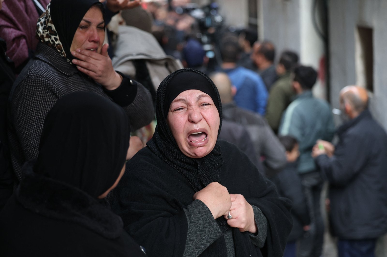 Palestinians mourn during the funeral of Samir Aslan, 41, at Qalandia refugee camp, occupied West Bank, Palestine, Jan. 12, 2023. (AFP Photo)