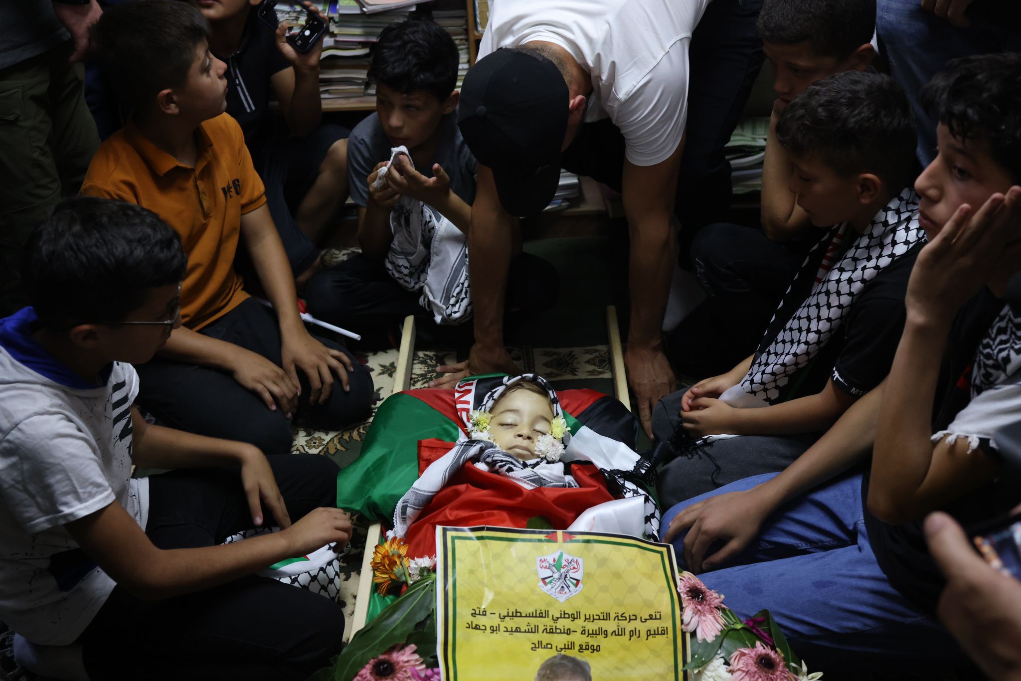 Palestinians participate in the funeral of two-year-old Muhammad Tamimi in the West Bank village of Nabi Saleh, who died four days after he was shot in the head by Israeli soldiers near the entrance to his home in Nabi Saleh, West Bank, June 6, 2023. (Oren Ziv)