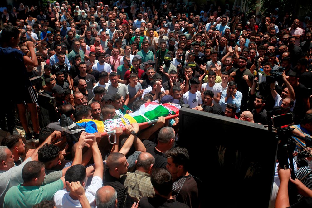 On July 22, 2023, mourners carry the body of Palestinian Fawzi Makhalfeh, 18,  who was killed by Israeli forces during his funeral in the town of Sebastia near Nablus in the West Bank.
