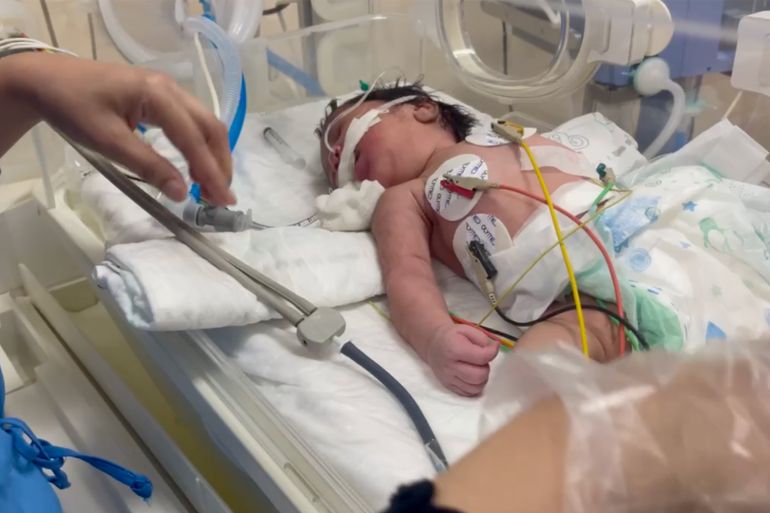 A baby in an incubator at Al-Aqsa Martyrs Hospital