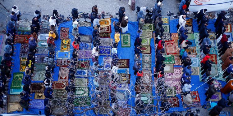 Palestinians hold Eid al-Fitr prayers, in Rafah
