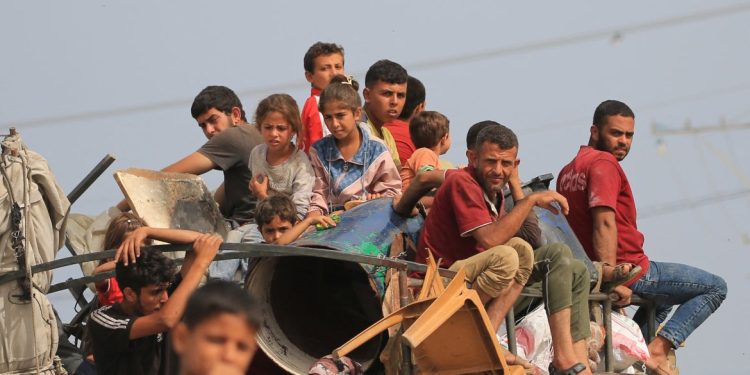 Palestinians flee the area of Tal al-Sultan in Rafah